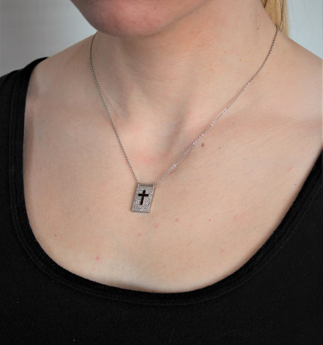 silver cross with zirconia pendant